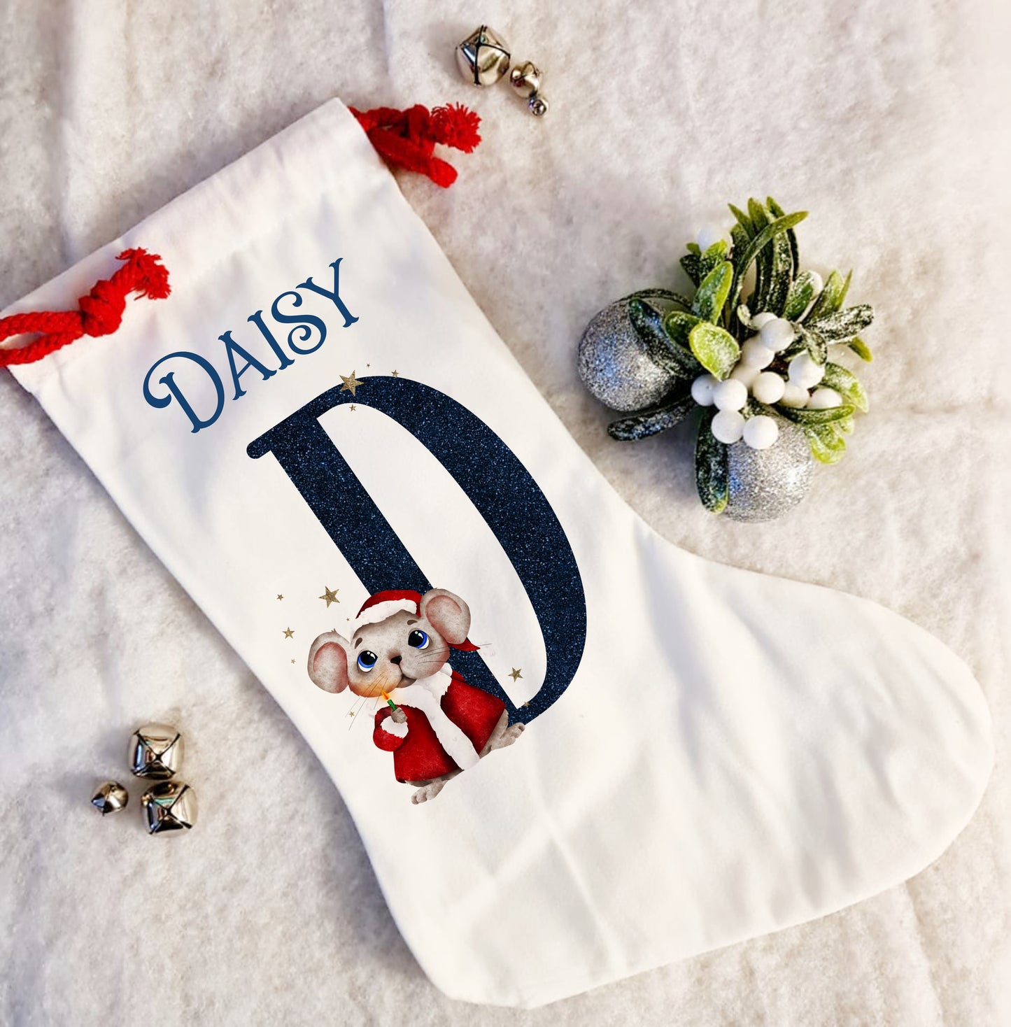 Personalised white Christmas stocking with a red rope tie and a Christmas mouse alphabet in red and navy