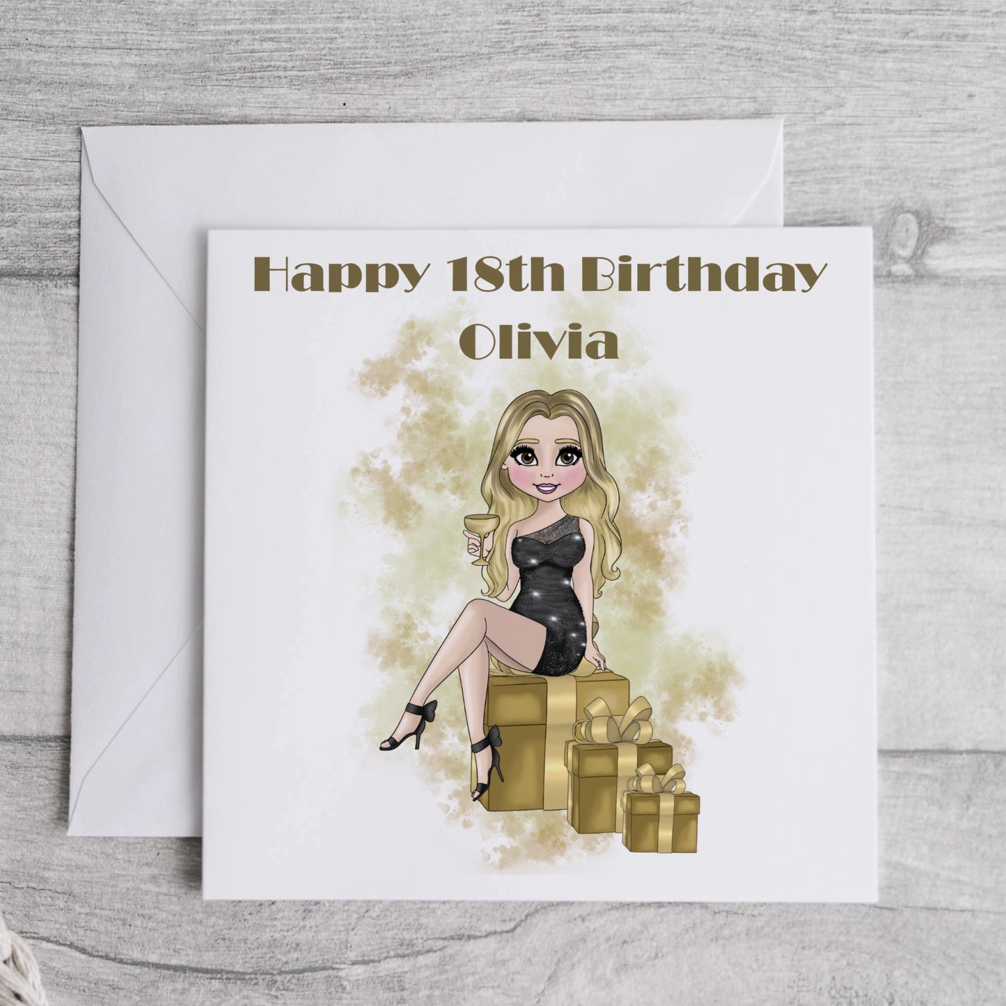 Printed personalised card featuring a girl in a cocktail dress holding a drink and sitting on gift boxes, in black and gold.