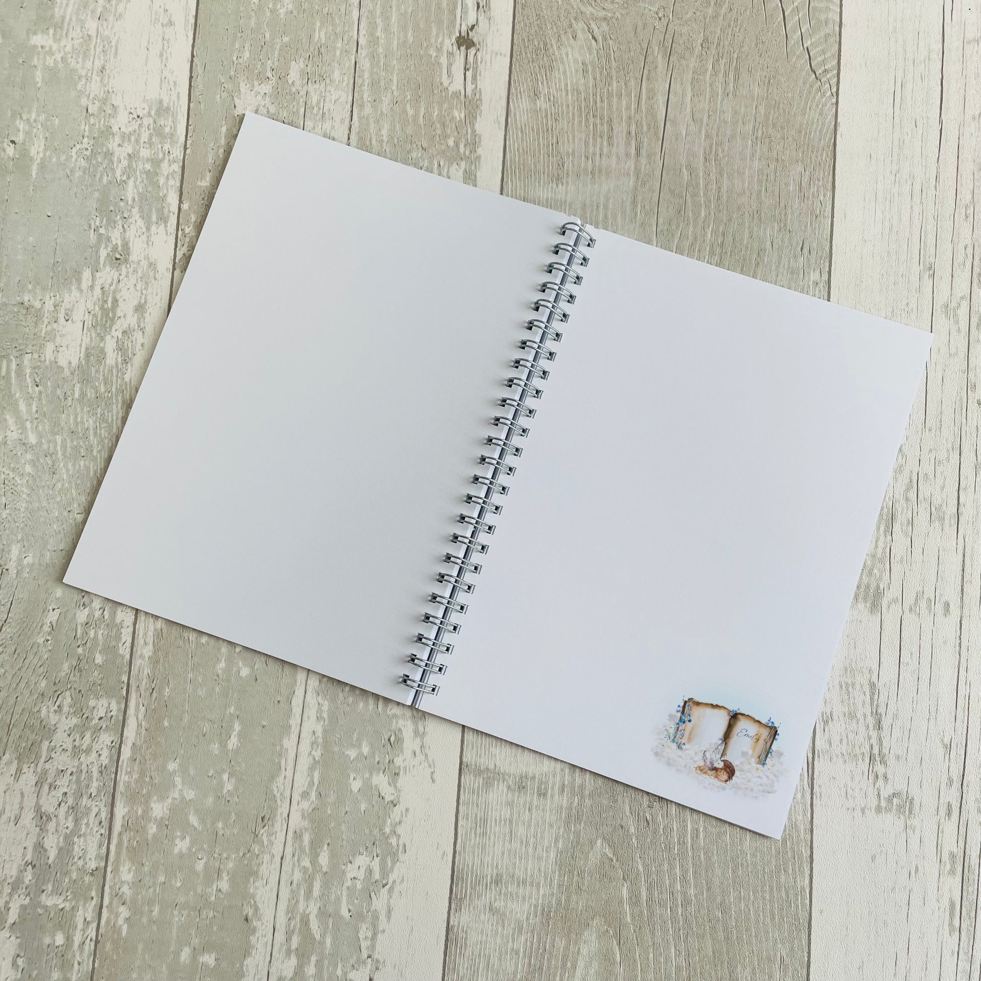 A5 memorial journal with an image of an angel baby on a book and personalised