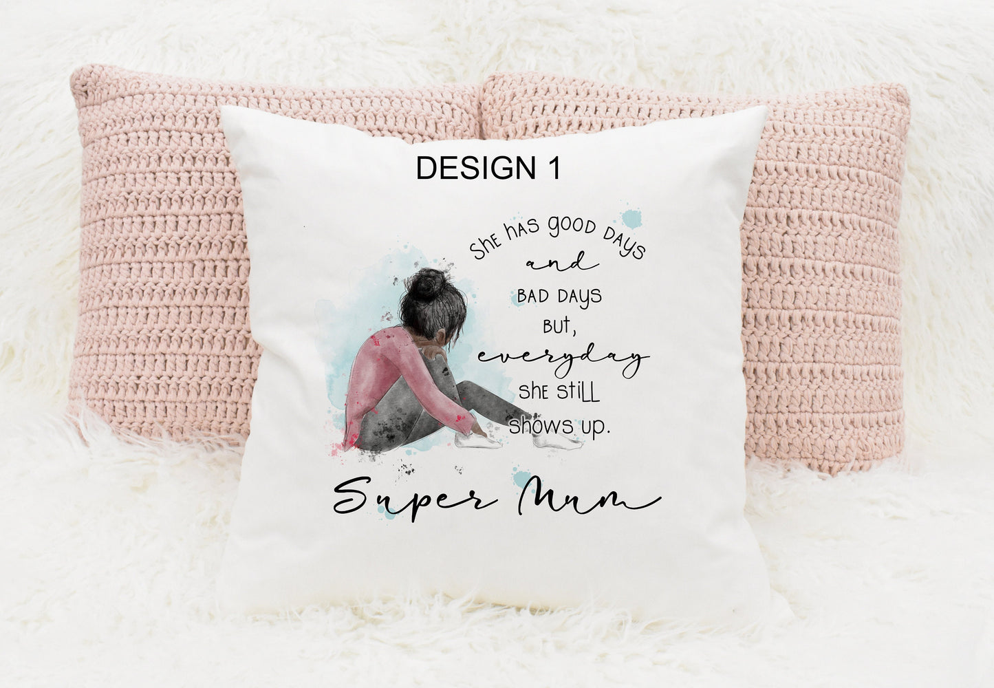 Square cushion featuring a watercolour design of a girl sitting down. Text reads 'She has good days and bad days but everyday she still shows up. Can be personalised.