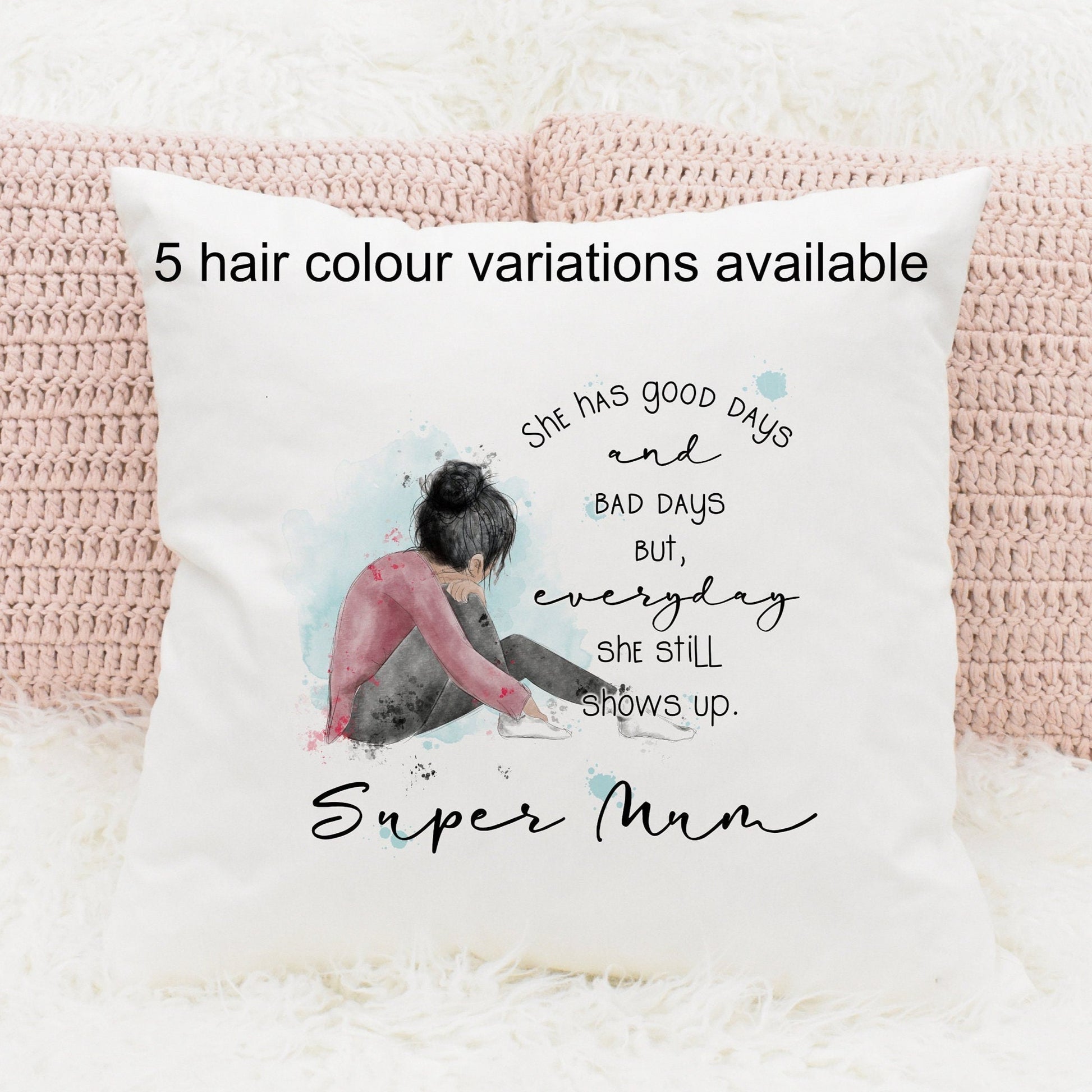 Square cushion featuring a watercolour design of a girl sitting down. Text reads 'She has good days and bad days but everyday she still shows up. Can be personalised.