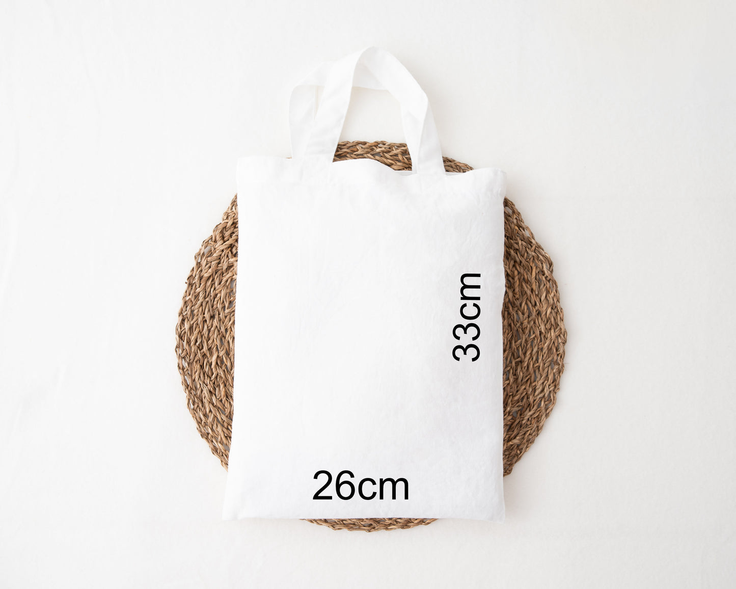 Easter egg hunt mini tote bag featuring a bunny ear rainbow in brown and is personalised
